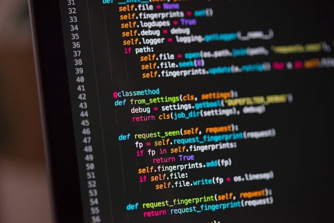 Code editor with colorful syntax highlighting displayed on a dark monitor screen