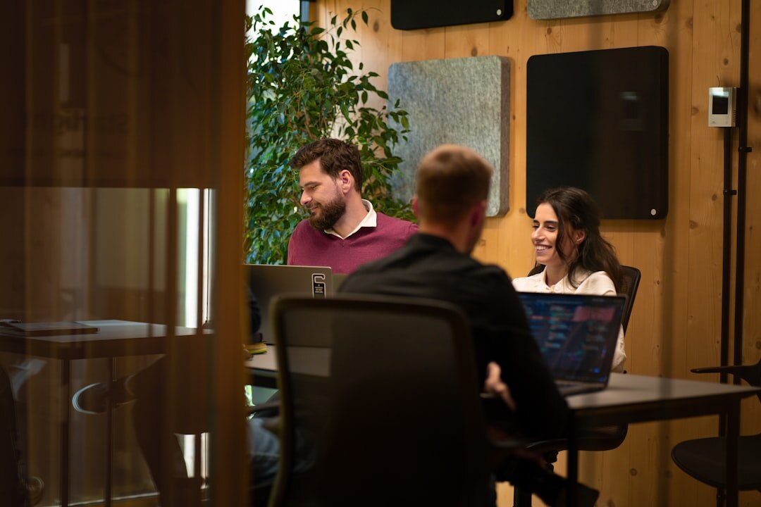 Modern startup office with open floor plan computers and collaborative workspace